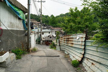 Seoul's last shanty town. Known as Village 104 it is only half filled with residents who live among empty neighbors waiting for demolition. 