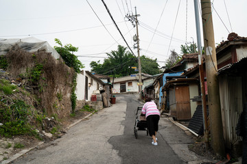 Seoul's last shanty town. Known as Village 104 it is only half filled with residents who live among empty neighbors waiting for demolition. 