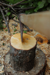 splitting wood with an ax