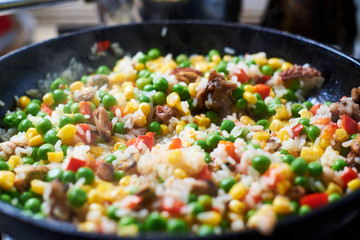 Fry vegetables in a pan. A mixture of different vegetables.