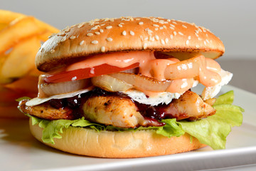 Hamburger with french fries on fairy plate