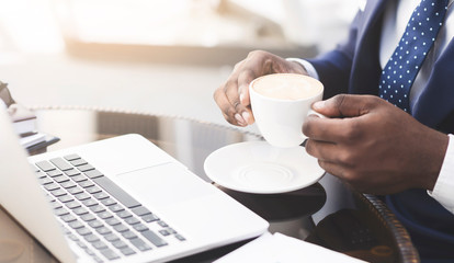 Entrepreneur Drinking Coffee Sitting At Laptop Working In Cafe, Closeup