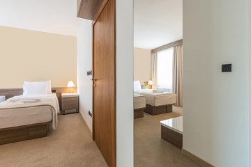 Interior of a modern double bed hotel bedroom