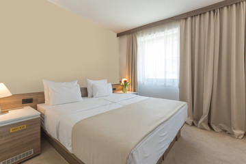 Interior of a modern double bed hotel bedroom