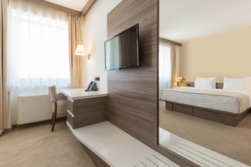 Fototapeta na wymiar Interior of a modern double bed hotel bedroom