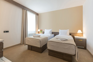 Interior of a modern double bed hotel bedroom
