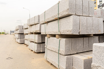 Stacks of grey concrete blocks for construction outside