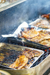 Meat grilling on grill