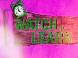 Conceptual hand writing showing Watch And Learn. Concept meaning demonstrating an action or ideas...