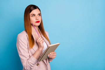Photo of minded smart high school girl touch chin pencil hold copybook look copyspace think decide...