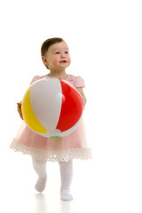 Little girl is playing with a ball.The concept of children's spo