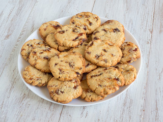 Fresh shortbread with dates on a white wooden table.