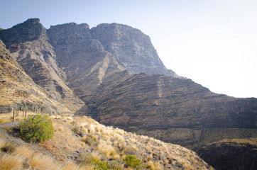 Volcanic edge cliff. Blue sky at the sunset. Canary Islands, Spain.