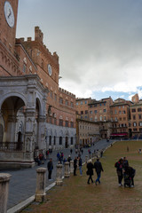 View of the famous " Piazza del Campo" ( Square of Campo) and "Palazzo Pubblico" ( Public Palace) in the city of Siena, Tuscany, Italy