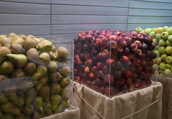 Pear and apple in glass bowl with space