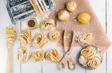 pasta with pasta ingredients on the dark wooden table top view