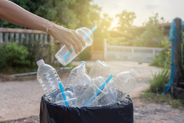woman holding recycling bin