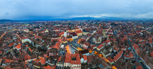 Wide panorama of Sibiu city, city center of Sibiu at evening twilight time