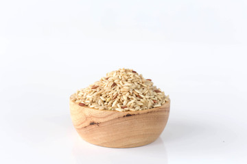 Brown rice in a wooden cup