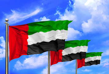 United Arab Emirates National Flags Waving In The Wind On A Beautiful Summer Blue Sky