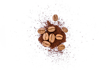 Roasted coffee beans with ground coffee on white background	