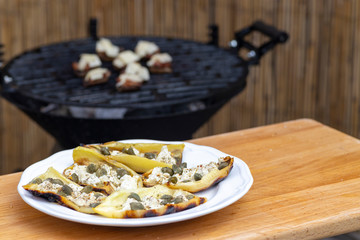 grilled peppers with feta cheese and capers and mushrooms with bacon baked with Emmental cheese