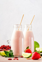 Healthy blended superfood drink. Organic diet smoothie with strawberry and goji berries, chia seeds...
