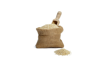 Organic quinoa grain in sack isolated on white.