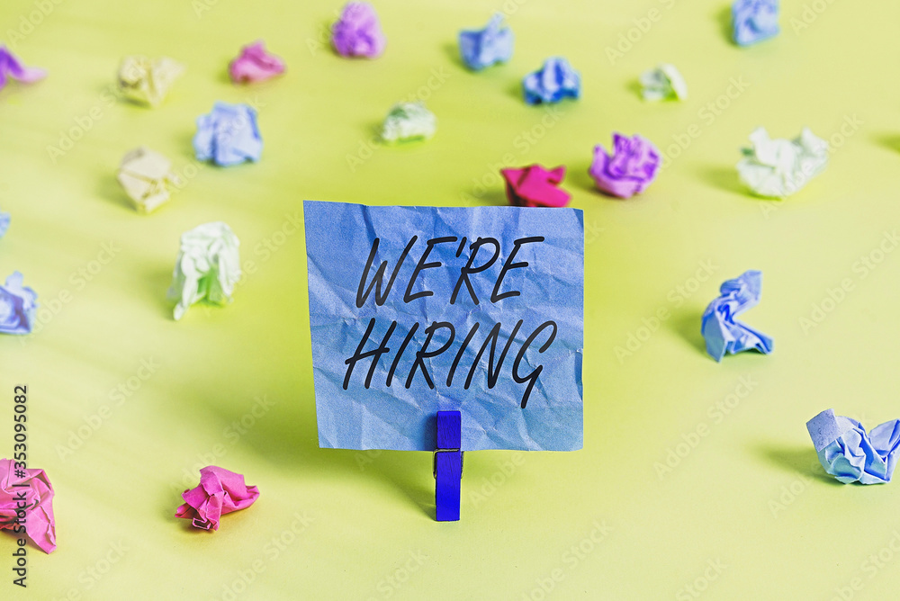 Poster handwriting text we re hiring. conceptual photo process of reviewing applications and finding candid