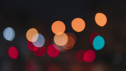 Night traffic light bokeh on road