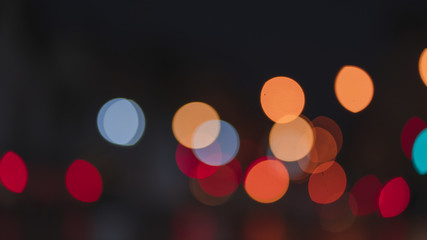 Night traffic light bokeh on road