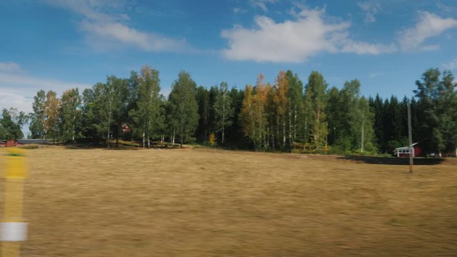Travelling on a scenic road in Sweden, a view from a car window