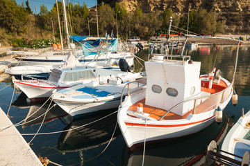 Fototapeta na wymiar Small wooden boats are moored in Tsilivi. Zakynthos