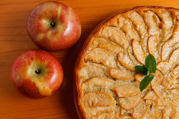 Homemade apple cake wooden background yellow cooking