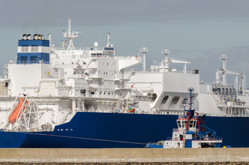 LNG TANKER - Ship and tugs are maneuvering at the gas terminal