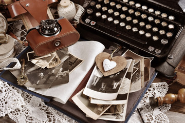 vintage style still life with old photographs and camera