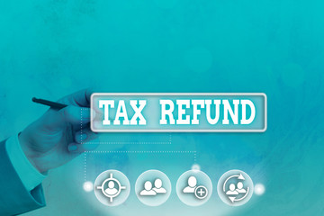Conceptual hand writing showing Tax Refund. Concept meaning refund on tax when the tax liability is...