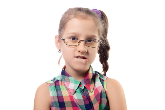 Little cute girl in glasses posing on a white background