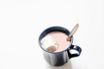 cocoa with marshmallow in a blue Cup