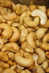close up of cashew nuts with black background.