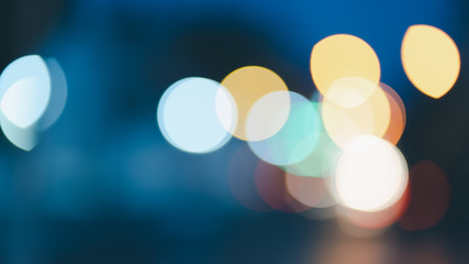 Night traffic light bokeh on road