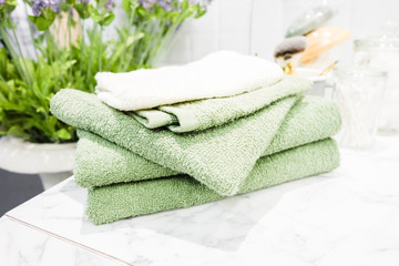 Obraz na płótnie Canvas Fresh clean bath towels in bathroom