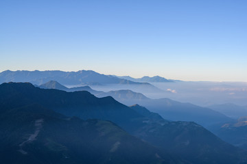 Naklejka na ściany i meble Hehuanshan Mountain Peak, Taiwan, Taroko National Park with fog and clear sky