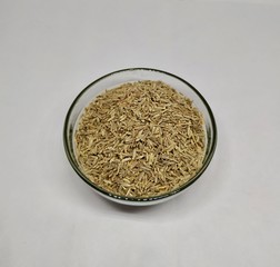 Common Cumin Or Zeera In A Glass Bowl On White background Stock Photo