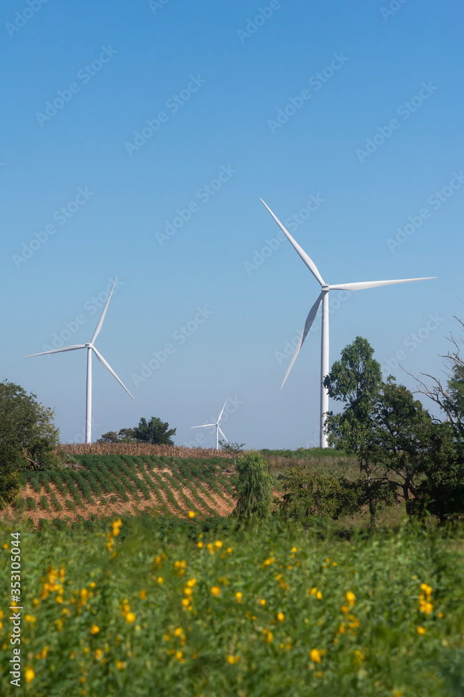 Aufkleber green garden with windmill turbine fields in the background
