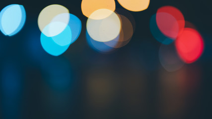 Night traffic light bokeh on road