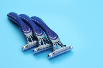 Layout from Shaving razors on a blue background