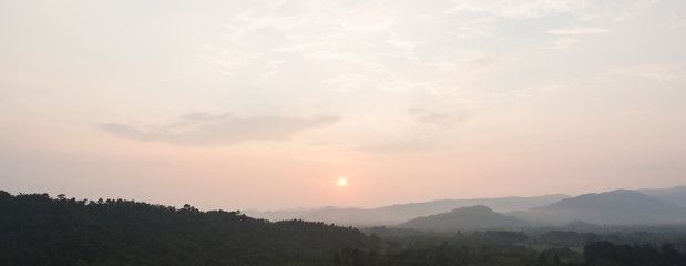 Sunset scene with silhouette mountain at Khun Dan Prakan Chon Dam	