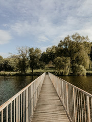 old wooden bridge on nature background