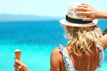 girl with ice cream near the sea